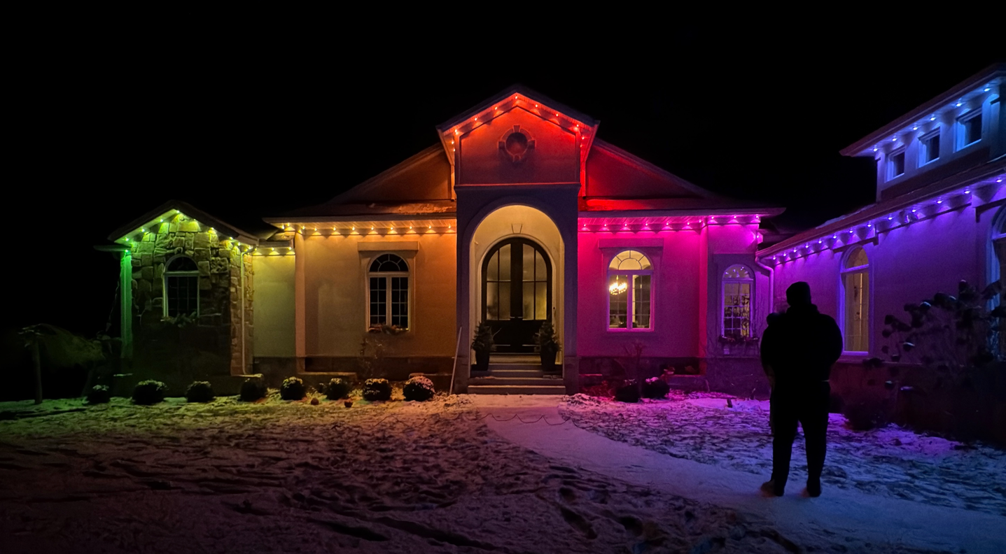 A person discussing a lighting plan with a homeowner.